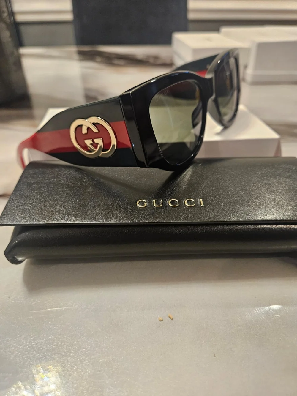 Gucci Black Cat-Eye Sunglasses with Green-Tinted Lenses